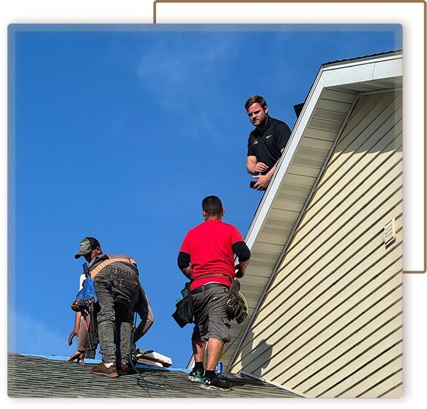 three installers on roof of house
